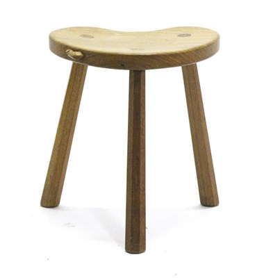 Lot 713 - Mouseman: A Robert Thompson Oak Cow Stool, on three legs, with carved mouse signature on seat,...