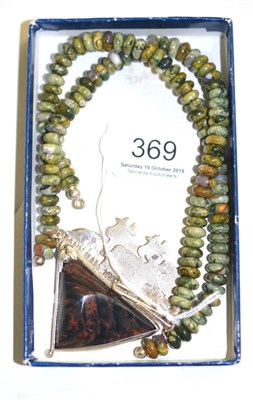 Lot 369 - A jasper necklace, green and brown beads with a central pendant in a brown and black colours...