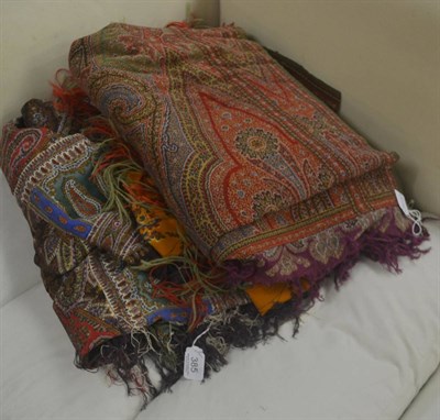 Lot 385 - Victorian woven paisley shawl and two smaller printed paisley shawls (3)