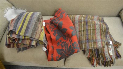 Lot 386 - A red and green floral cloth, McNab tartan shawl together with a South American shawl (3)