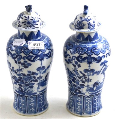 Lot 401 - A pair of 19th century Chinese blue and white vases and associated covers, 29cm high