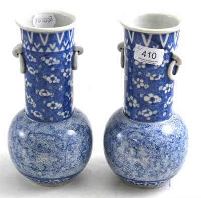 Lot 410 - A pair of Japanese blue and white vases, 23cm high