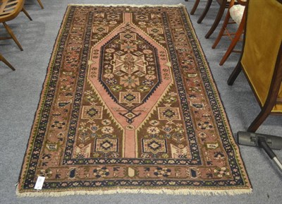 Lot 503 - A woollen orange ground Afghan rug