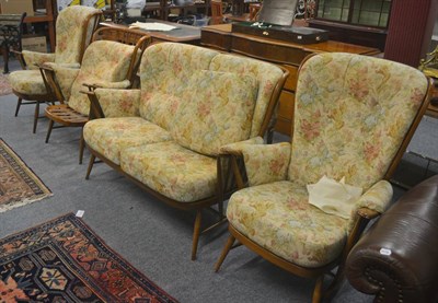 Lot 505 - A four piece Ercol suite