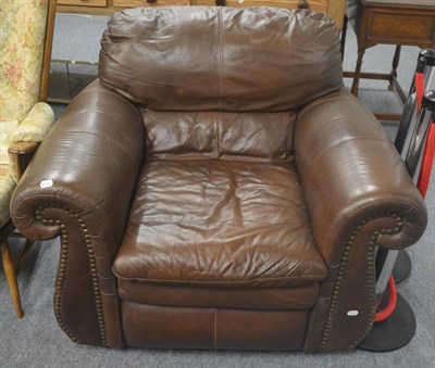 Lot 506 - A modern brown leather armchair