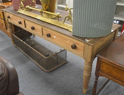 Lot 507 - A large Victorian pitch pine three drawer serving table