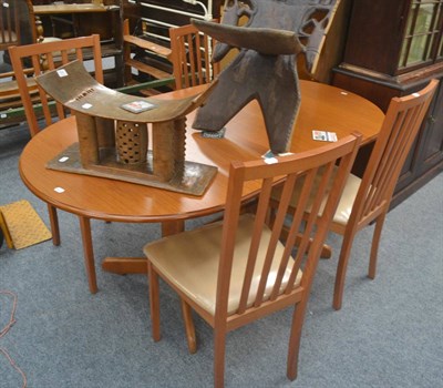 Lot 513 - Set of four dining chairs by The Morris Furniture Company and matching extending table