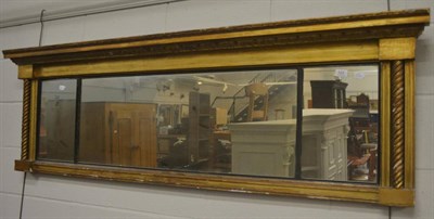 Lot 522 - A 19th century gilt and ebonised wall mirror