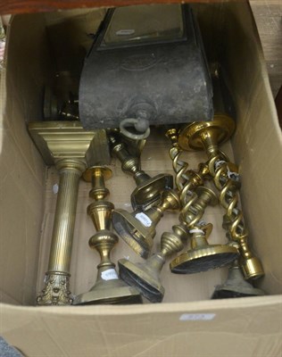 Lot 573 - A set of four Victorian brass candlesticks (two pairs), four odd ones, a brass lamp and a lamp base