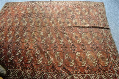 Lot 597 - A 19th century Kizin Ayak Turkman carpet, Emirate of Bukhara, the madder field of Tank Naska...