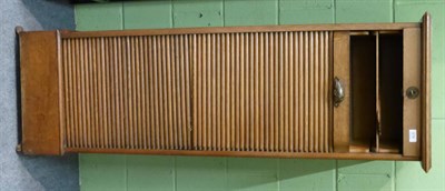 Lot 676 - An oak tambour fronted filing cabinet