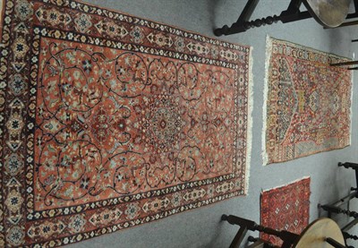 Lot 680 - An Indian rug of Central Persian design, The field with central medallion enclosed by scrolling...