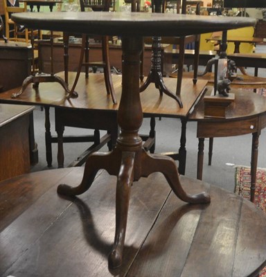 Lot 682 - An 18th century oak tripod table