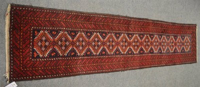 Lot 690 - Very narrow Balouch runner, Persian/Afghan Frontier, the indigo field of serrated guls enclosed...