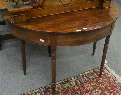 Lot 691 - A 19th century demi-lune mahogany side table, formerly an end section of a D-end dining table