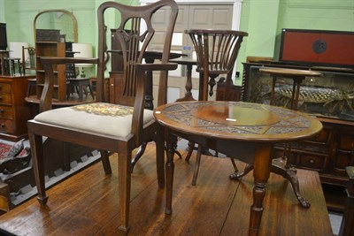 Lot 700 - A mahogany armchair and a mahogany circular occasional table carved with flowers