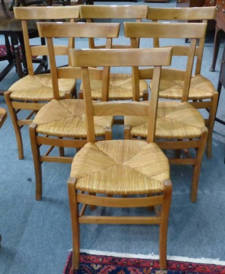 Lot 709 - A set of six cherrywood rush seated dining chairs