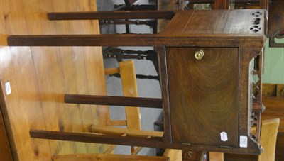 Lot 710 - A Georgian mahogany pot cupboard with gallery top