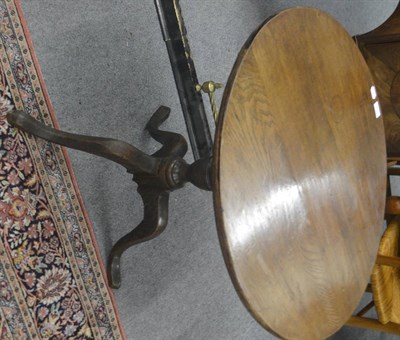 Lot 712 - An 18th century oak tripod table