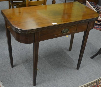 Lot 713 - A 19th century mahogany fold-over tea table