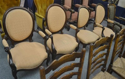 Lot 719 - A set of four Victorian rosewood chairs comprising of three armchairs and one single chair