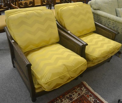 Lot 724 - Two modern bergere style armchairs with modern upholstery