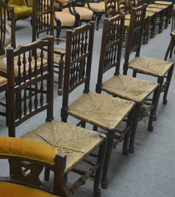 Lot 731 - A set of four rush seated 18th century spindle back country chairs