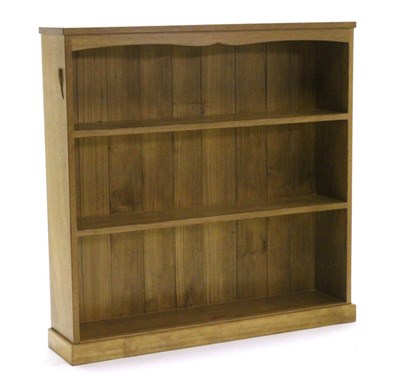 Lot 749 - Lizardman: A Derek Slater English Oak Open Bookcase, the rectangular top above a shaped rail, three