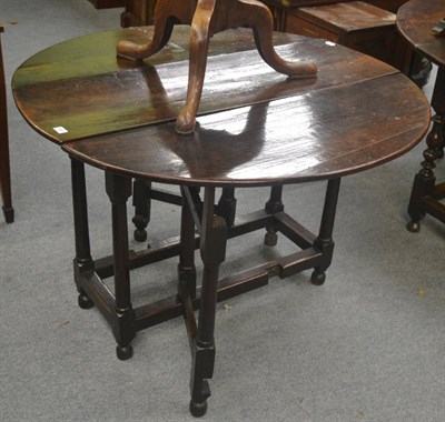 Lot 742 - An 18th century oak gateleg dining table