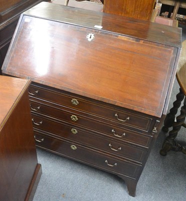 Lot 757 - A Georgian mahogany inlaid bureau