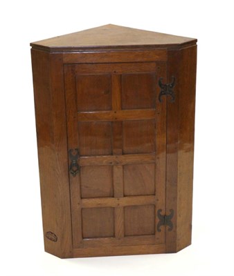 Lot 755 - Oak Leafman: A Fred Suffield English Oak Corner Cupboard, with wrought iron hinges and latch,...