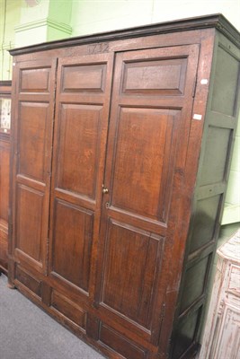 Lot 785 - A large oak panelled housekeepers cupboard dated 1732