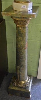 Lot 789 - A pair of onyx and brass mounted columns