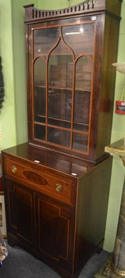 Lot 791 - A mahogany bookcase on cabinet with astragal glazed door