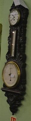 Lot 792 - A late Victorian carved barometer