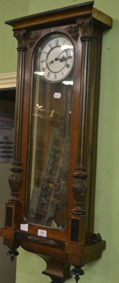 Lot 795 - Walnut and ebonised Vienna type wall clock