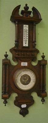 Lot 802 - A carved oak barometer