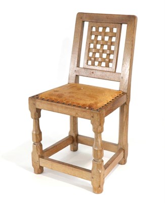 Lot 759 - Sid Pollard of Bagby: An English Oak Child's Chair, lattice panel back, upholstered nail cow...