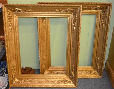 Lot 834 - A pair of Italian 19th century carved and gilded frames, with plain sight, sanded frieze with...