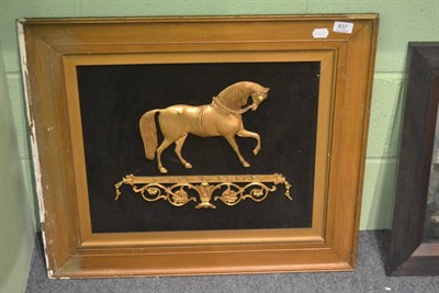 Lot 837 - A Victorian brass horse in relief mounted on black velvet