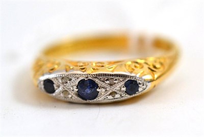 Lot 19 - An 18ct gold sapphire and diamond ring