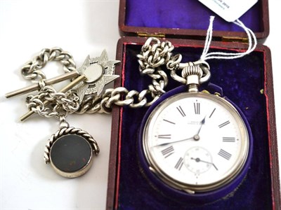 Lot 34 - An open faced pocket watch, case stamped 'fine silver', with a silver watch chain