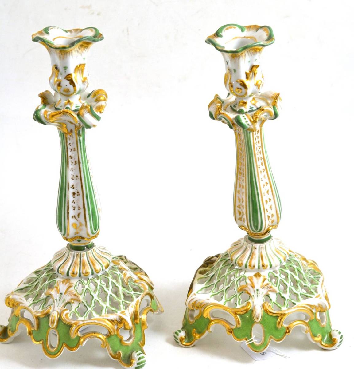 Lot 44 - Pair of porcelain green and gilt candlesticks (restored)