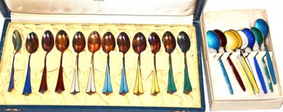 Lot 61 - Two sets of enamel spoons and a plated circular tray