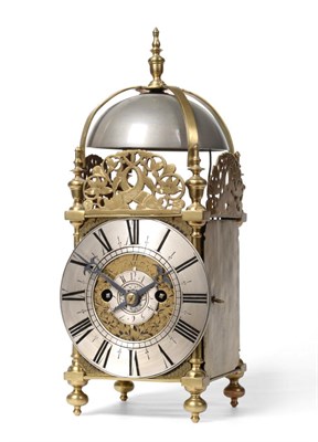 Lot 774 - A Brass Striking Lantern Clock, four posted case with side doors and side frets, silvered...