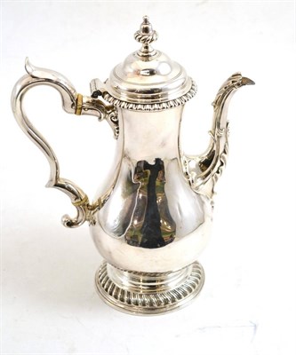 Lot 76 - A George III silver coffee pot, Charles Wright, London 1769, of pear form with acanthus capped...