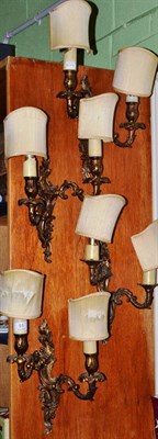 Lot 91 - A set of four French style two branch wall lights