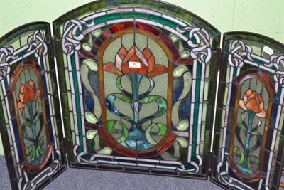 Lot 95 - A leaded glass three fold firescreen