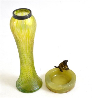 Lot 132 - Art Nouveau iridescent vase with silver rim and an Art Deco pin dish mounted with a terrier (2)