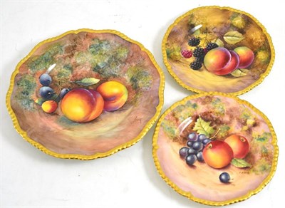 Lot 136 - A Royal Worcester fruit painted plate signed J Cook, 20cm wide and two saucers signed Till and...